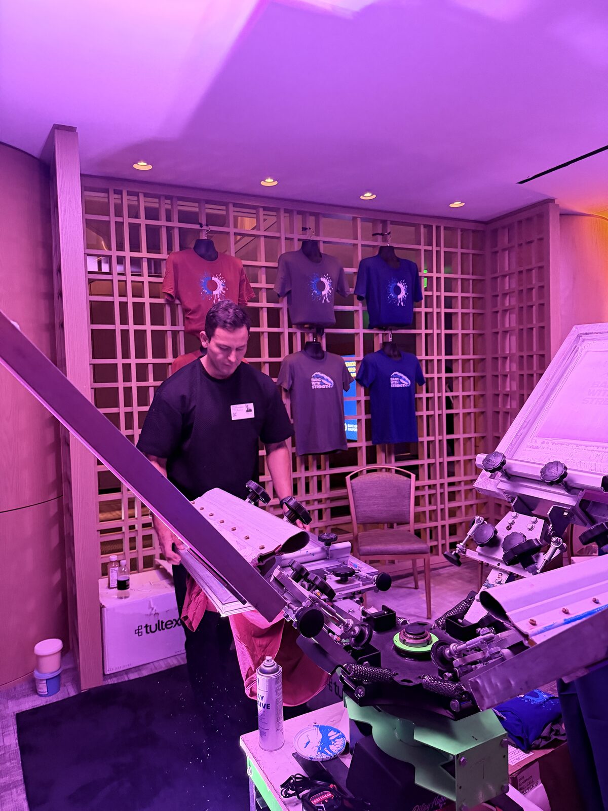 A blank shirt loaded onto the heat press at the booth