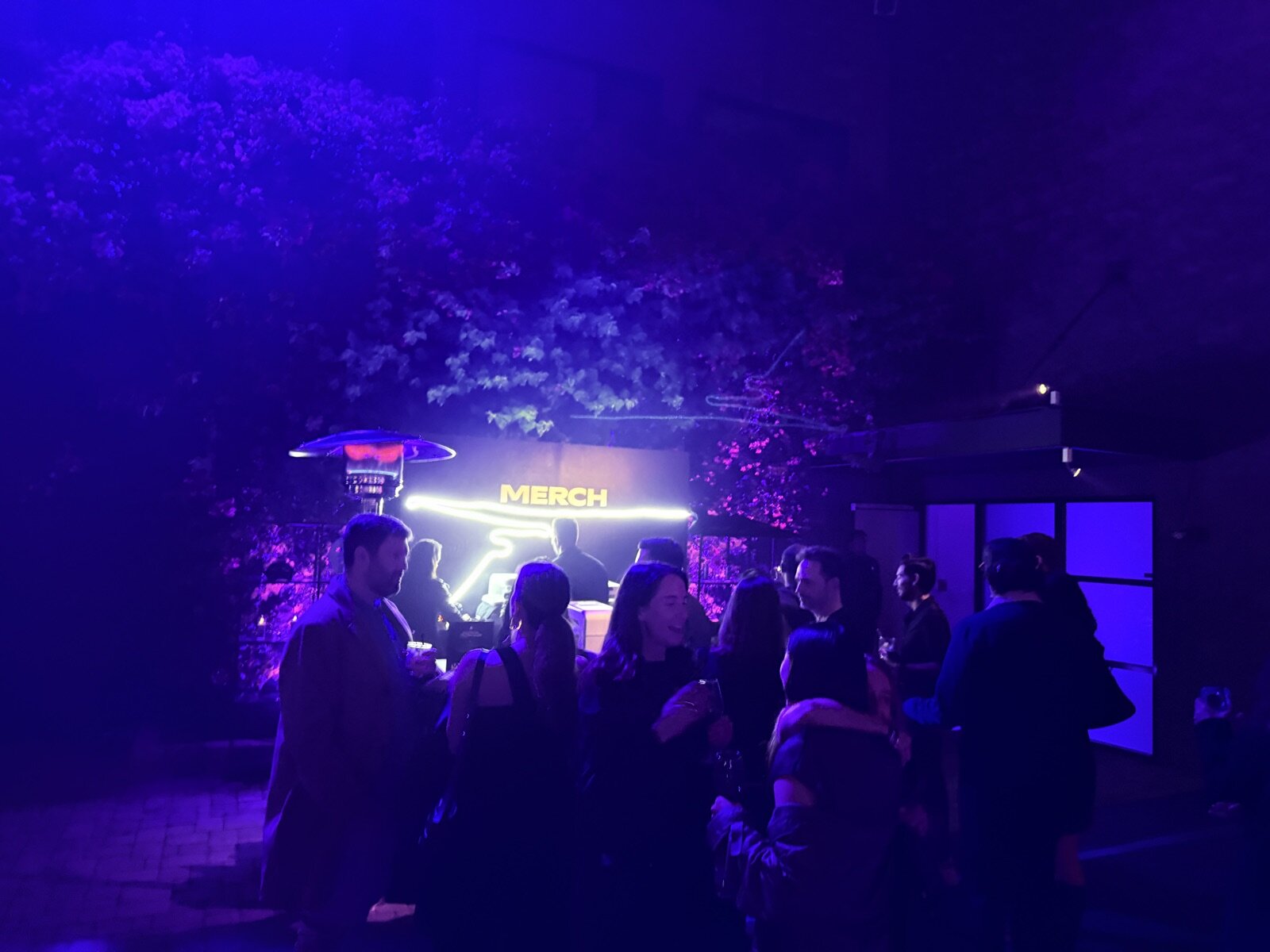 Wide view of a Merch Troop printing booth at a brand activation
